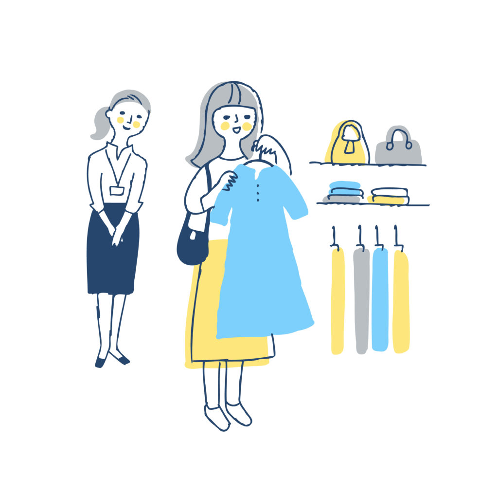 アパレル店員が顧客につきっきりでショッピングをサポートしている様子